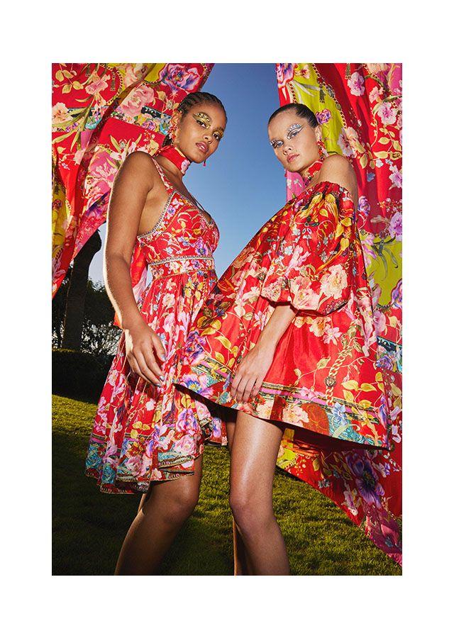 women in silk red dresses