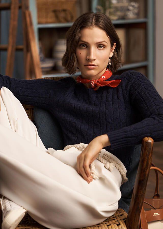 Seated woman in classic 1950s styled jumper