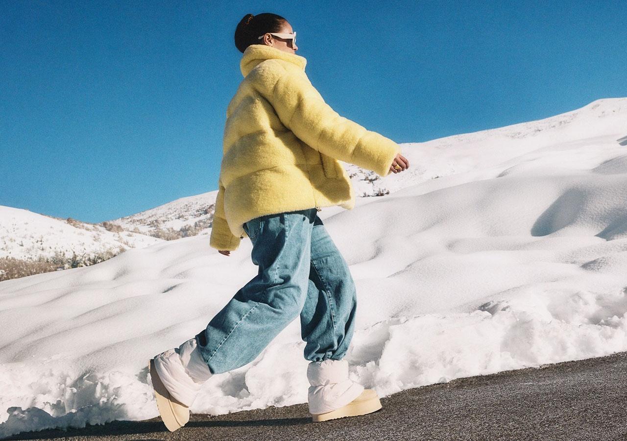  Woman in yellow jacket and trendy beige platform boots for winter 