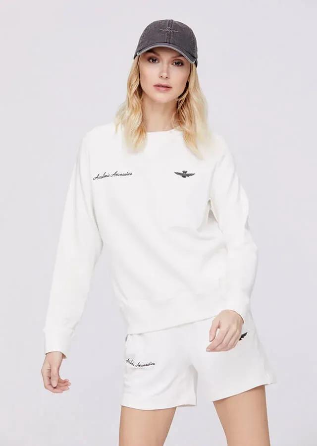 woman in white sweatshirt and shorts