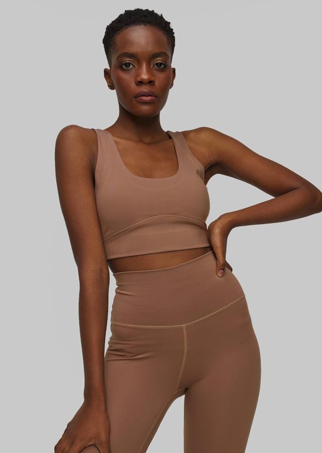 Woman in beige sports set for the gym Woman in beige sports set for the gym