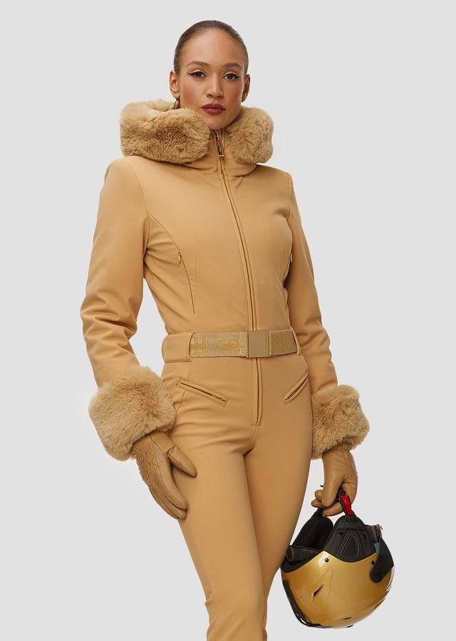 Kobieta w złotym kombinezonie narciarskich Goldbergh Gold Exclusive Kobieta w złotym kombinezonie narciarskich Goldbergh Gold Exclusive